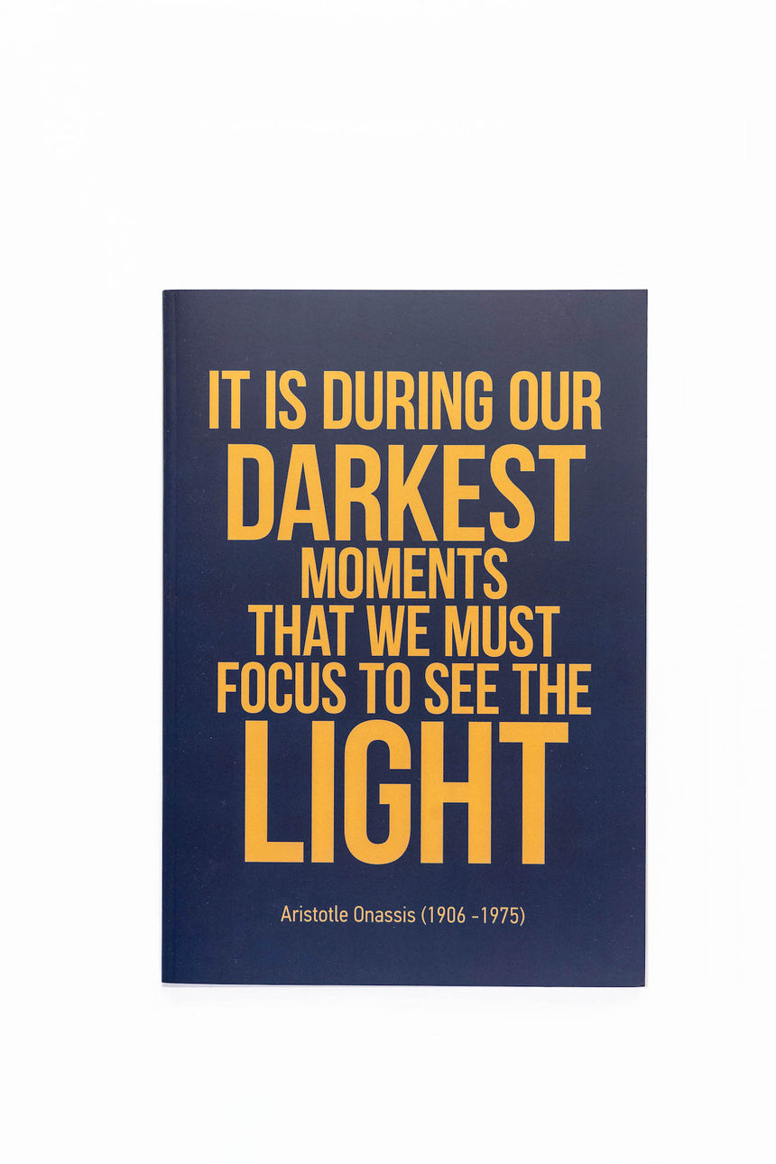 It is during our darkest moments pin notebook